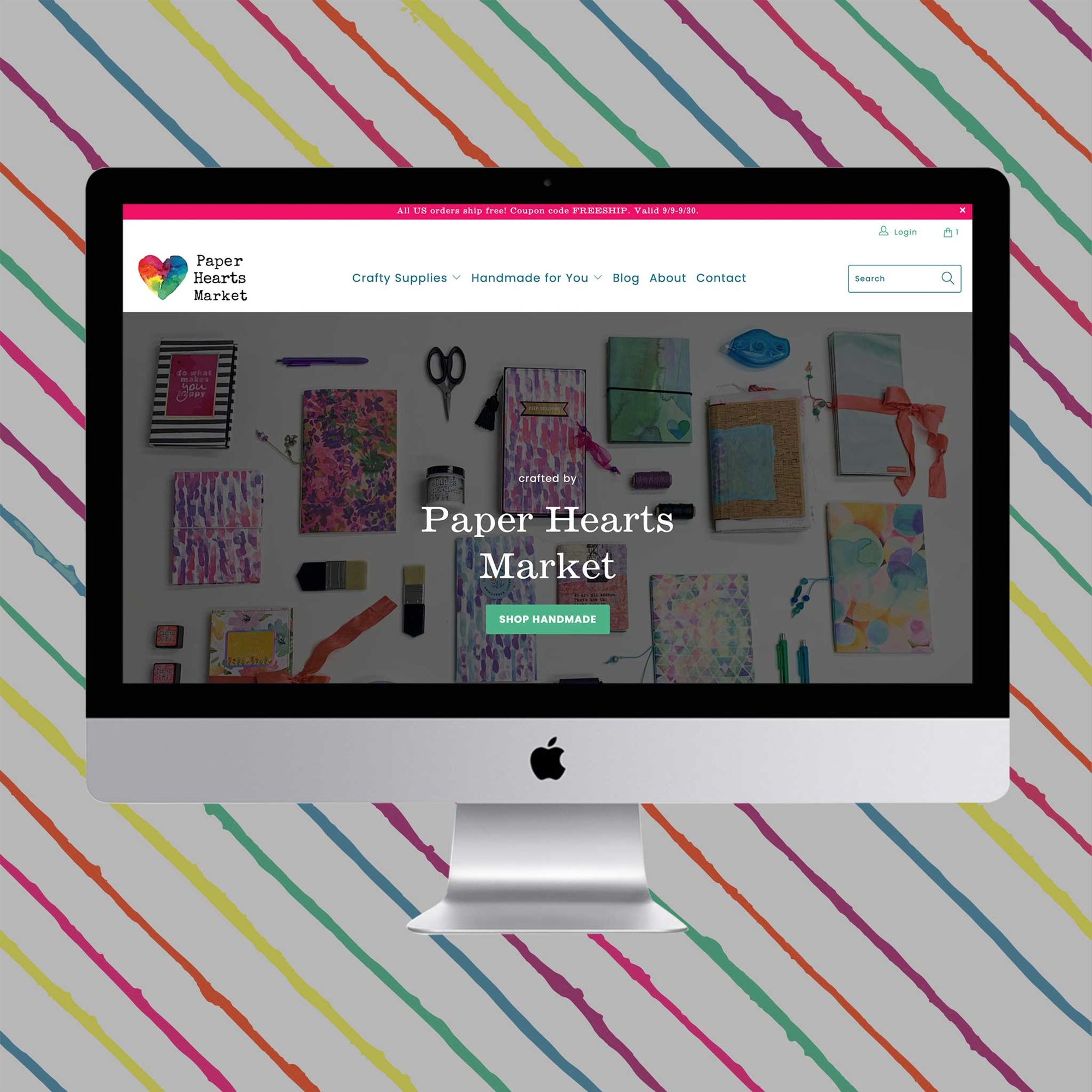 Home Page mockup for Paper Hearts Market on a desktop computer with a hand painted striped background